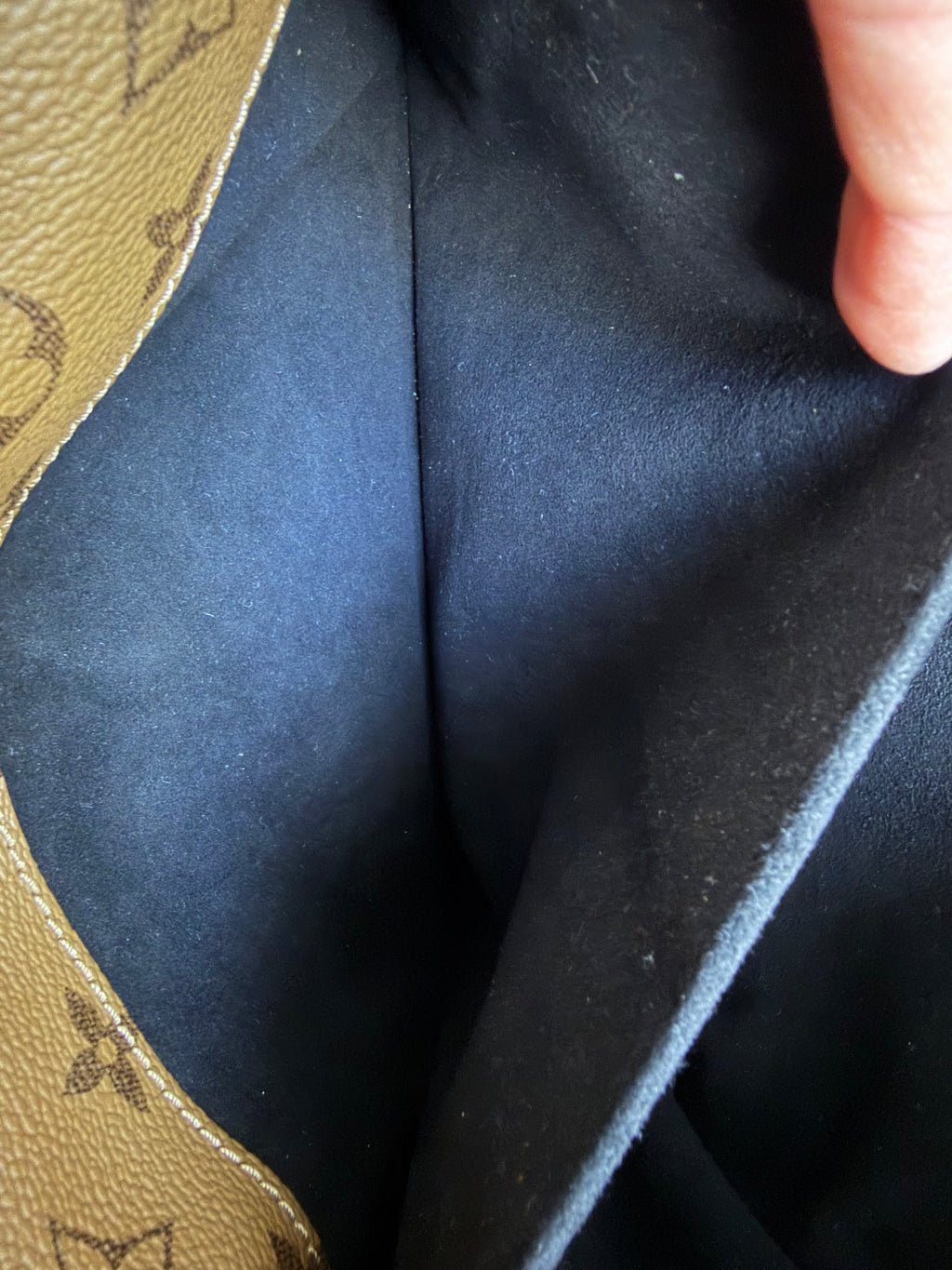 Pochette Métis in Reverse Monogram